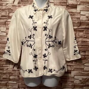 Elegant Embroidered Blouse with Black Floral Design